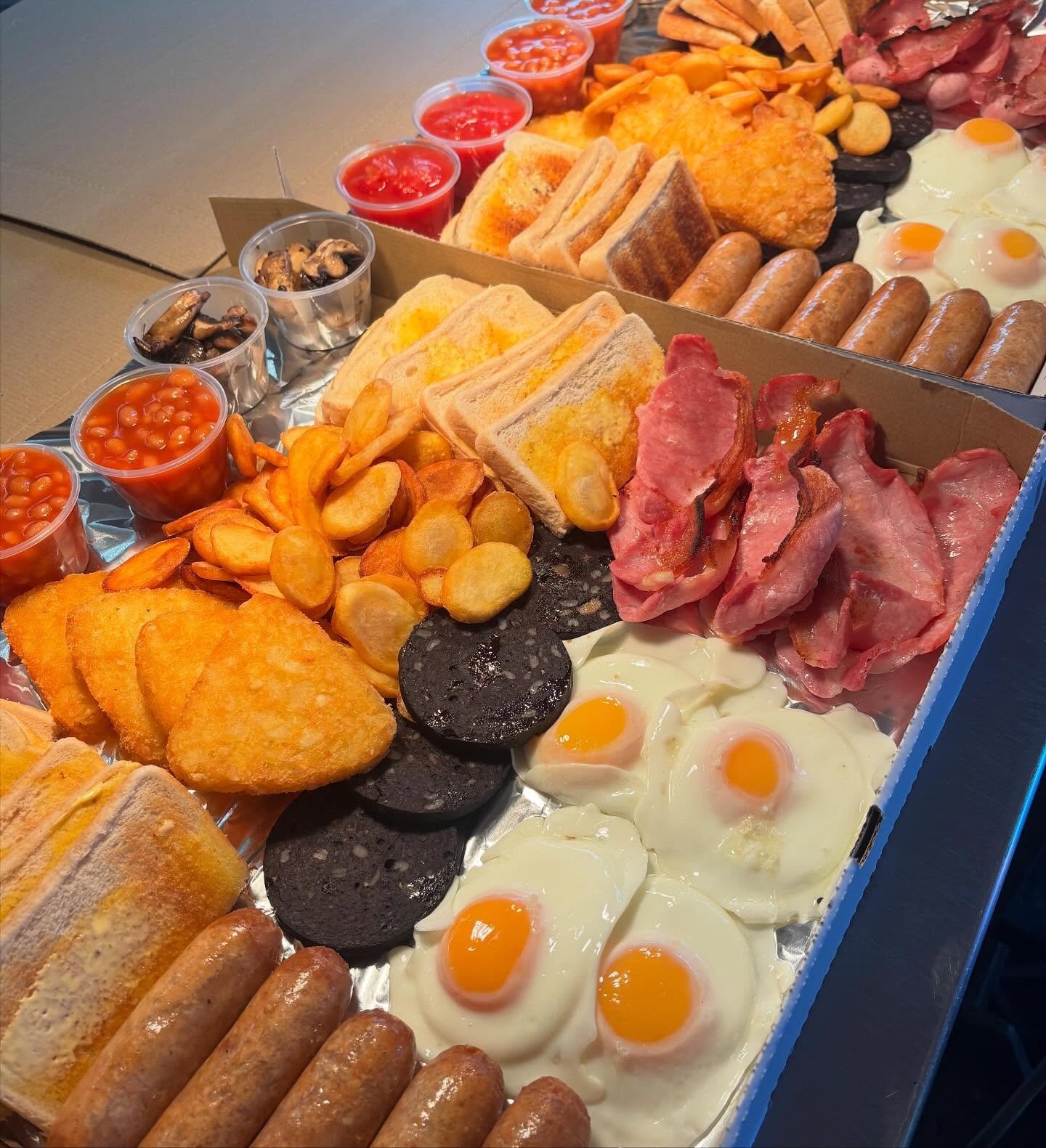 Giant breakfast grazing box with hash browns, sausages, fried eggs, bacon and beans from The Oven Door Cafe near St Helens